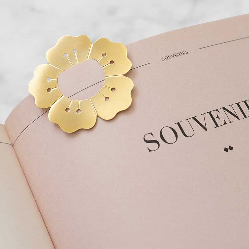 Octaevo Multi-Use Clips – Capri showing flower-shaped clip on a book page