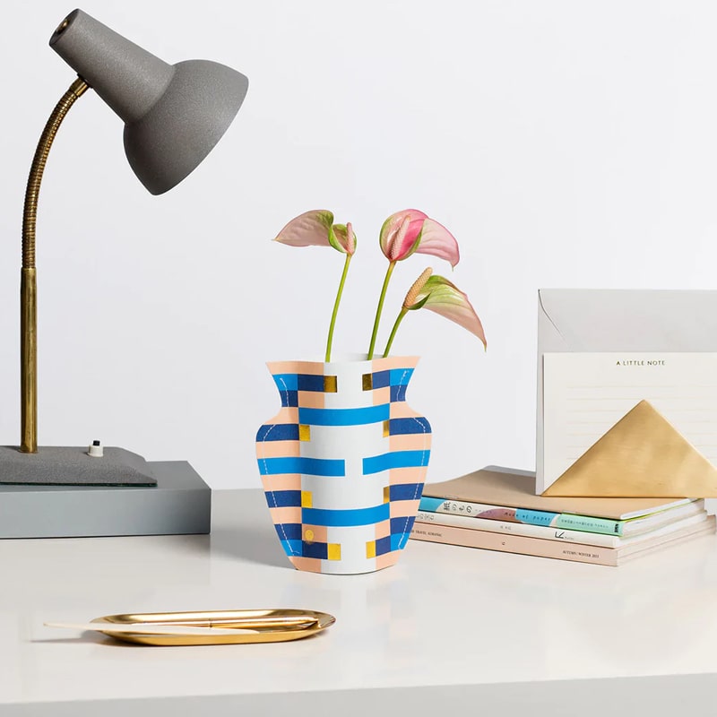 Octaevo Mini Paper Vase Costa shown on a desk with flower inside and lamp and books beside
