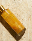 Gas Bijoux Ensoleille Moi Huile Scintillante - Product shown on counter