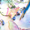 Moth & Myth North American Insect Watercolor Kit - Insect displayed with flowers and paint brushes. 