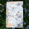 Moth & Myth North American Insect Coloring Kit - Product displayed on top of flowers