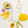 Innersense Organic Beauty Serenity Smoothing Cream - Product displayed with fruit and flowers