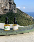 La Selva Positano Cosmetici Naturali Prickly Pear And Cyst - Lifestyle shot, product displayed with mountains in the background