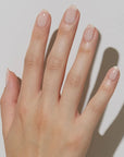 JINsoon Nail Lacquer - Dew - Product shown on models hand