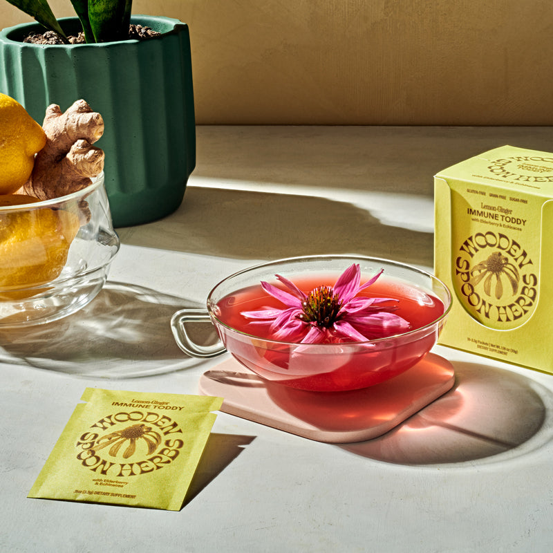 Wooden Spoon Herbs Lemon Ginger Immune Toddy Sachets - Product shown prepared, displayed on table