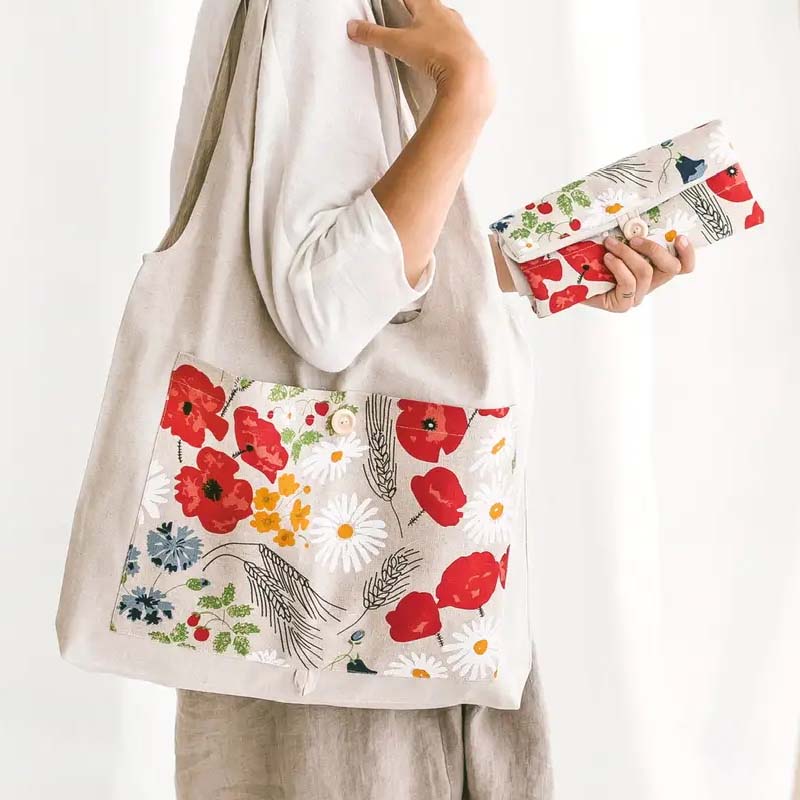 Sava Seasons Linen Foldable Tote – Wildflowers - Model shown wearing product on shoulder