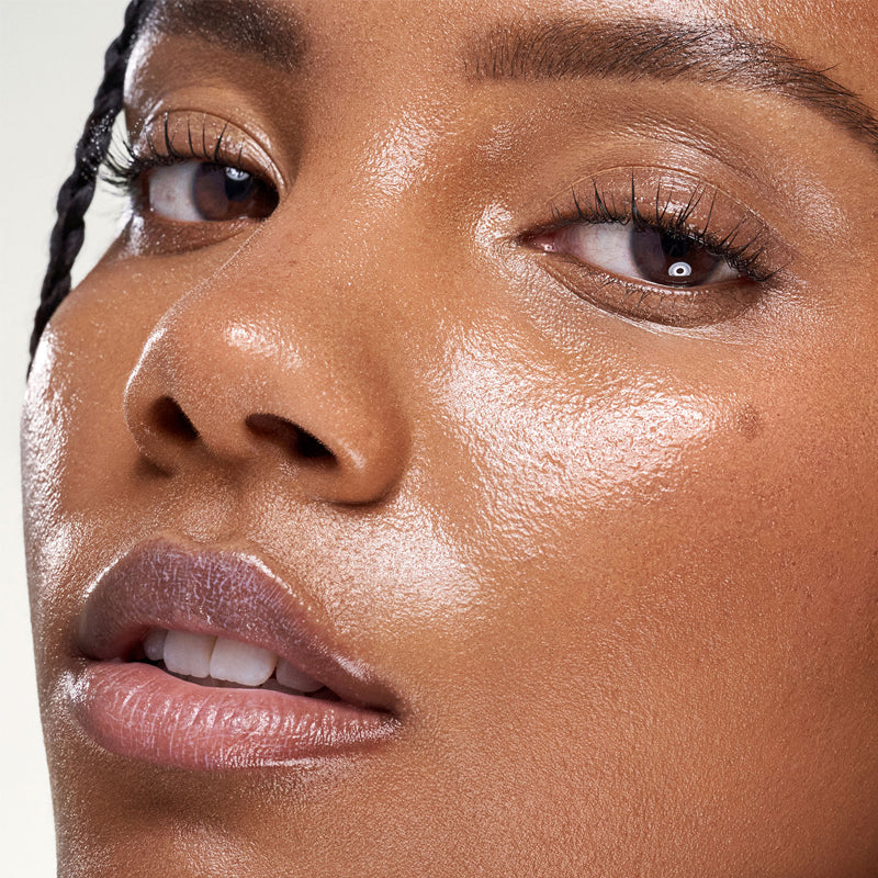 Kosas Plump & Juicy Vegan Collagen Spray-On Serum - Closeup of models face after applying product