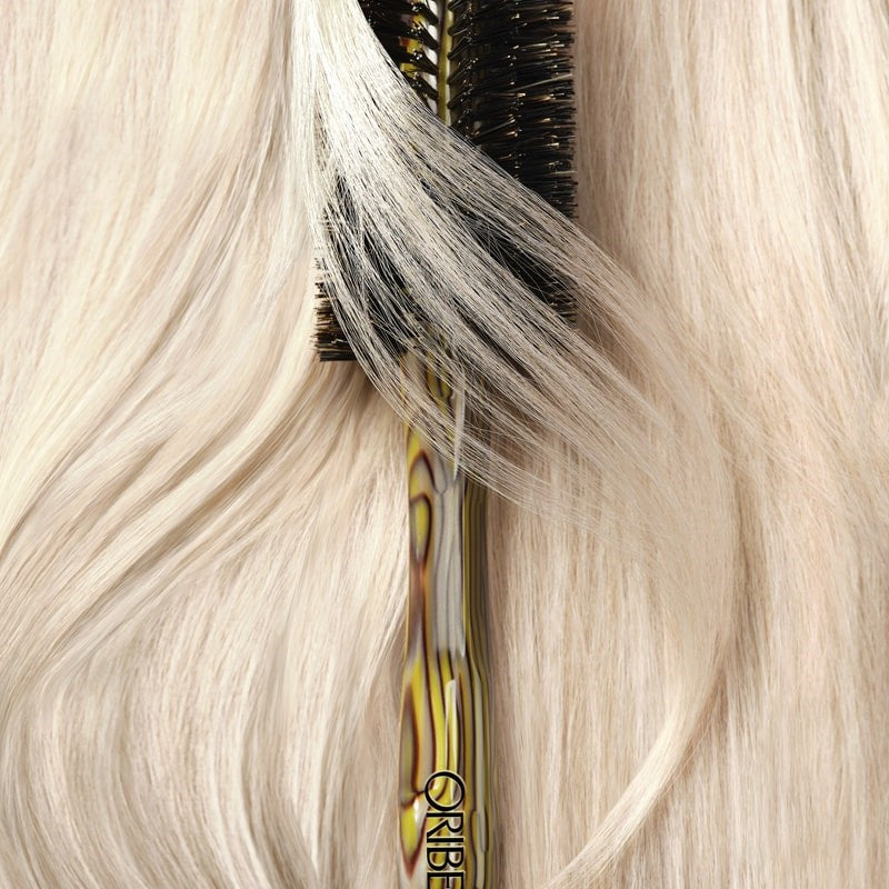Oribe Beechwood Large Round Brush - Product displayed on top of hair