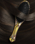 Oribe Italian Resin Flat Brush - Product shown in models hair 