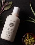 Neil Naturopathic Finishing Formula - Lightweight Conditioner - Product displayed next to plants