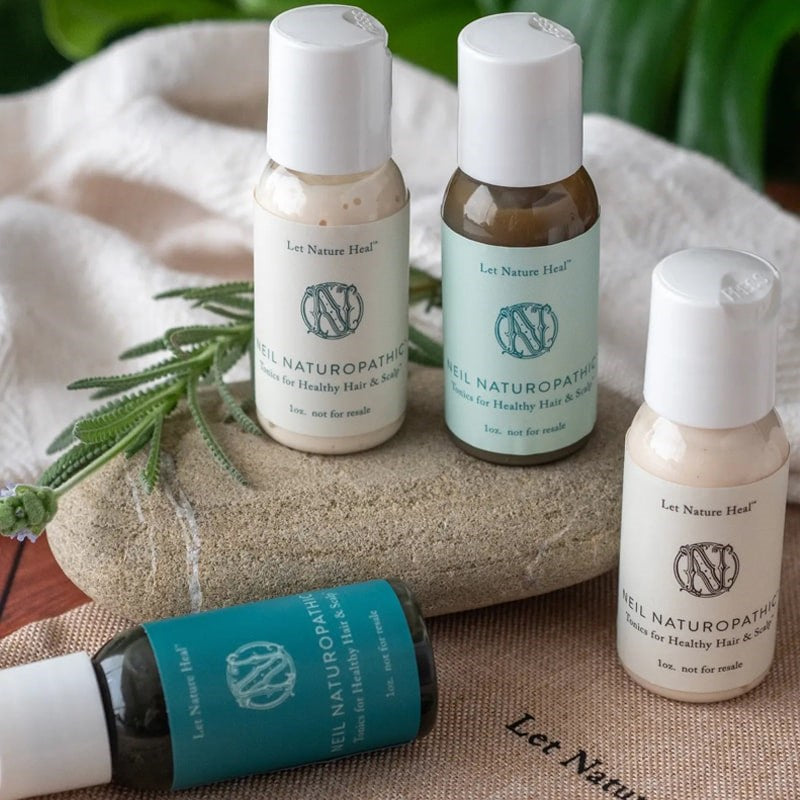 Neil Naturopathic Mini-NN Sample Pack - Products displayed on rock 