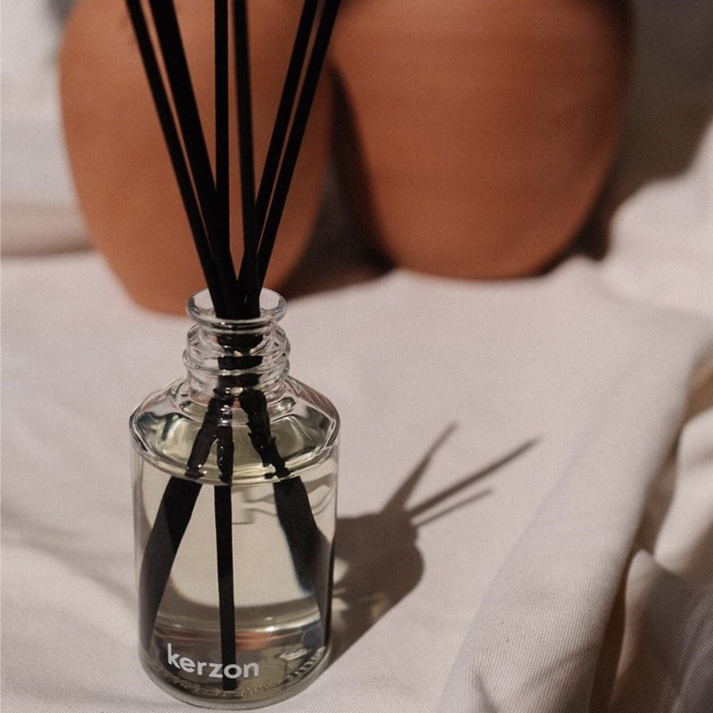 Kerzon Home Fragrance Diffuser – Place des Vosges - Closeup of product displayed on table cloth. 