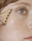 Odacite Cryo-Tech Facial Tool - Model shown using product in cheek