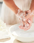 Olverum Purifying Hand Wash - Model shown washing hands