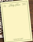 Herb Lester Associates Fictional Hotel Notepad Fawlty Towers - Product shown on wood table