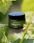 Pelegrims Facial Balm - Product displayed with foliage