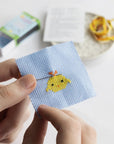 Marvling Bros Ltd Kawaii Chick Mini Cross Stitch Kit In A Matchbox - Finished product shown in models hand