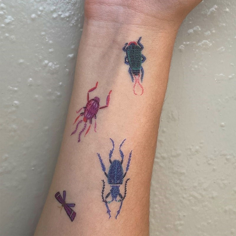 Idlewild Co Entomologist Temporary Tattoos - Product shown on models forearm.