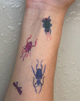 Idlewild Co Entomologist Temporary Tattoos - Product shown on models forearm.