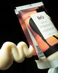 R+Co Dallas Biotin Thickening Hair Treatment - Product smear shown next to product