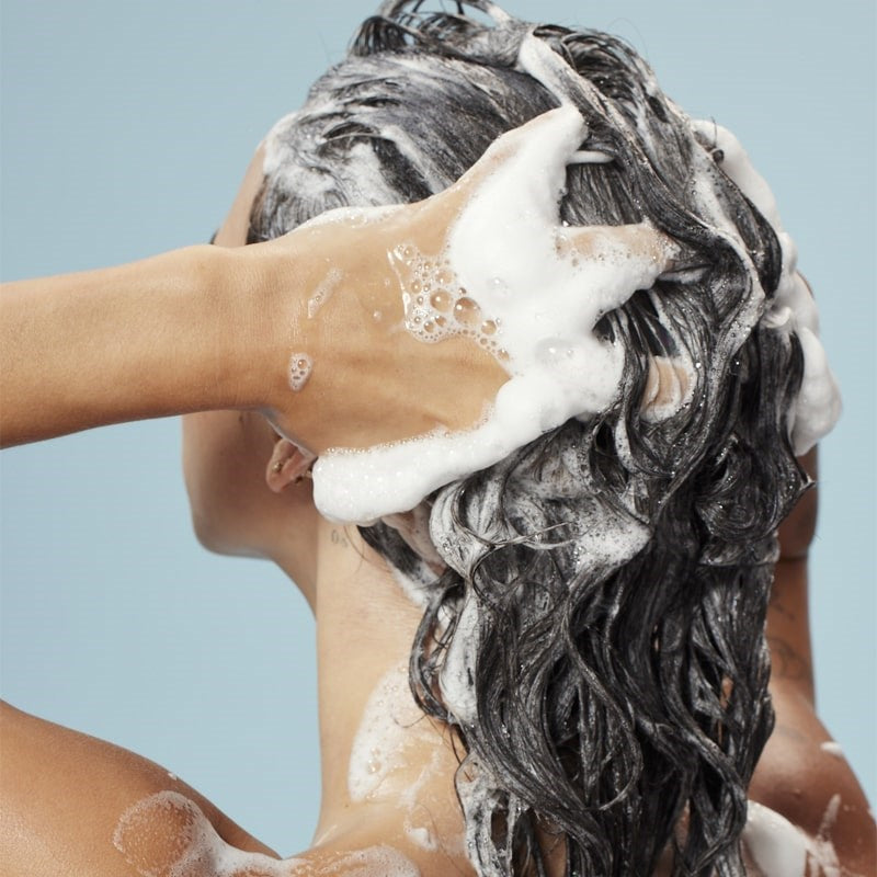 Innersense Organic Beauty Clarity Hairbath - Model shown washing hair with product