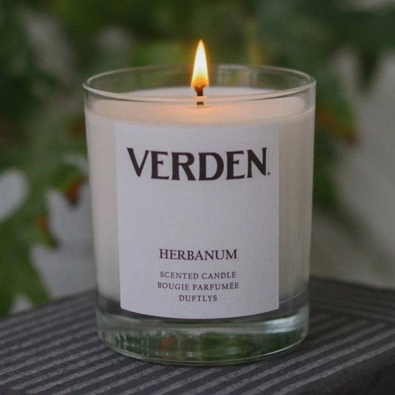 Verden Herbanum Scented Candle - Product displayed on table. 