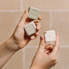 LES PANACEES 3-in-1 Travel Set - In the Shade of Cypresses displaying all 3 soaps being held in hands