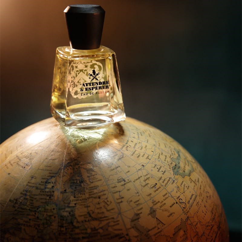 Frapin Attendre & Esperer Eau de Parfum - Product displayed on top of globe