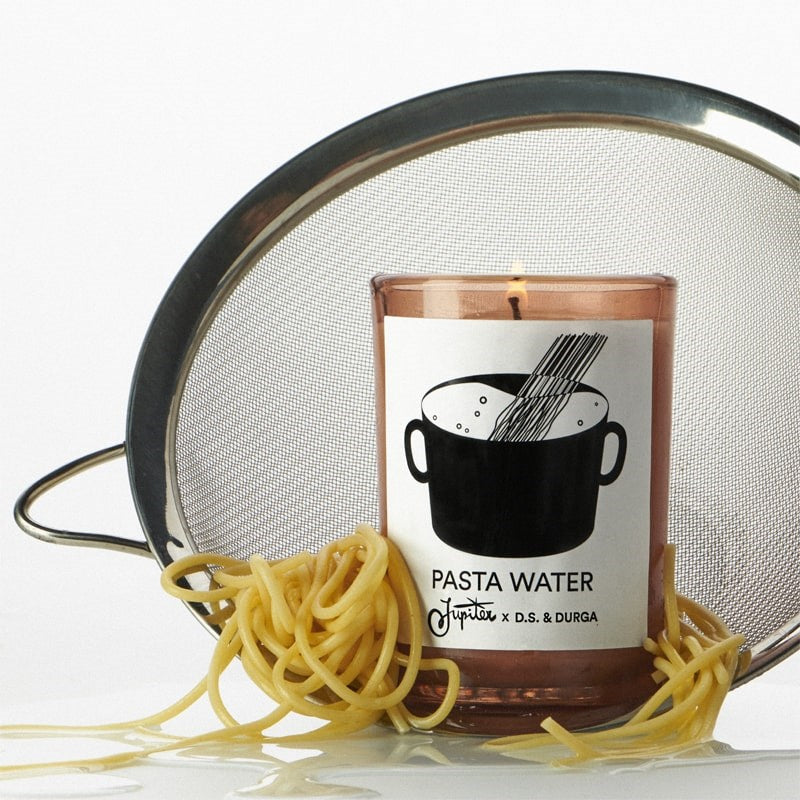 D.S. & Durga Pasta Water Candle - Product shown with pasta and strainer