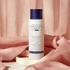 Christophe Robin Night Recovery Monoi Oil with White Lotus Flower - Product displayed in front of pink sheet
