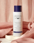 Christophe Robin Night Recovery Monoi Oil with White Lotus Flower - Product displayed in front of pink sheet