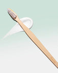 Davids Premium Bamboo Toothbrush - Product shown on top of toothpaste smear