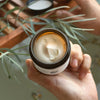 8 Days Botanicals Serenity Body Butter - Model shown holding open jar