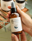 8 Days Botanicals Serenity Botanical Room Spray - Product shown in models hand