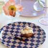 BLU KAT Round Checker Serving Tray - Indigo/Almond - Fork and pastry displayed on tray.