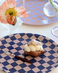 BLU KAT Round Checker Serving Tray - Indigo/Almond - Fork and pastry displayed on tray.
