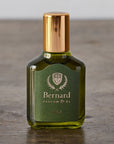 Bernard Parfum Eira Roll On Parfum Ol Bijou - Product displayed on wood table.