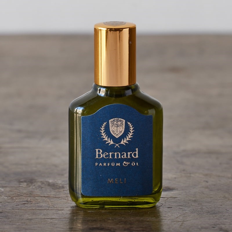 Bernard Parfum Meli Roll On Parfum Ol Bijou - Product displayed on wood table