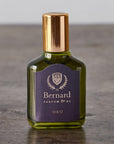 Bernard Parfum Oro Roll On Parfum Ol Bijou - Product displayed on wood table