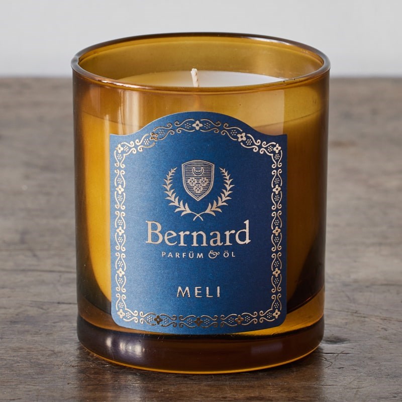 Bernard Parfum Meli Candle - Product displayed on wood table