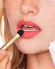 Yolaine La Mousse de Rouge - Pivoine - Closeup of model applying product to lips