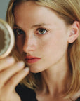 Yolaine The Mirror - Model shown with product in hand
