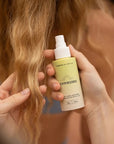 Suntouched Suntouched Hair Lightener For Light Hair - Model shown holding product next to hair