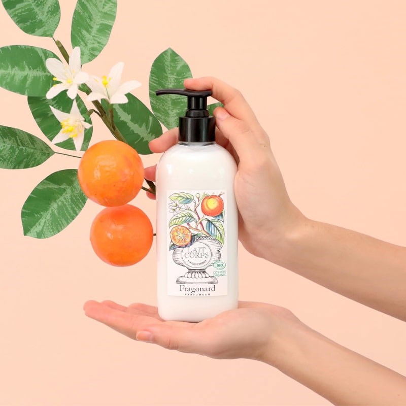 Fragonard Parfumeur Body Lotion - Orange Blossom - Product shown in models hand