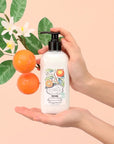 Fragonard Parfumeur Body Lotion - Orange Blossom - Product shown in models hand