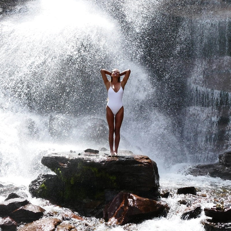 ISUN Eshin Scalp & Hair Serum - Lifestyle photo of model near a waterfall