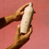 Flamingo Estate Organics Euphoria Body Lotion- Product shown in models hand