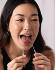 Wonder Oral Wellness Tongue Cleaner - Model photo using the tongue cleaner