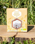 Les Abeilles de Malescot Tangerine and Orange Rooibos Infusion Tea - Product shown on tree stump