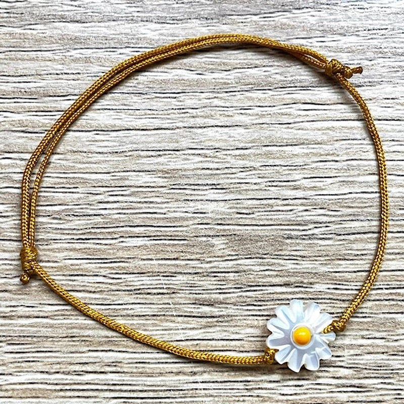 YSIE Yellow Marguerite Mother-of-Pearl Adjustable Bracelet - Product displayed on wood background